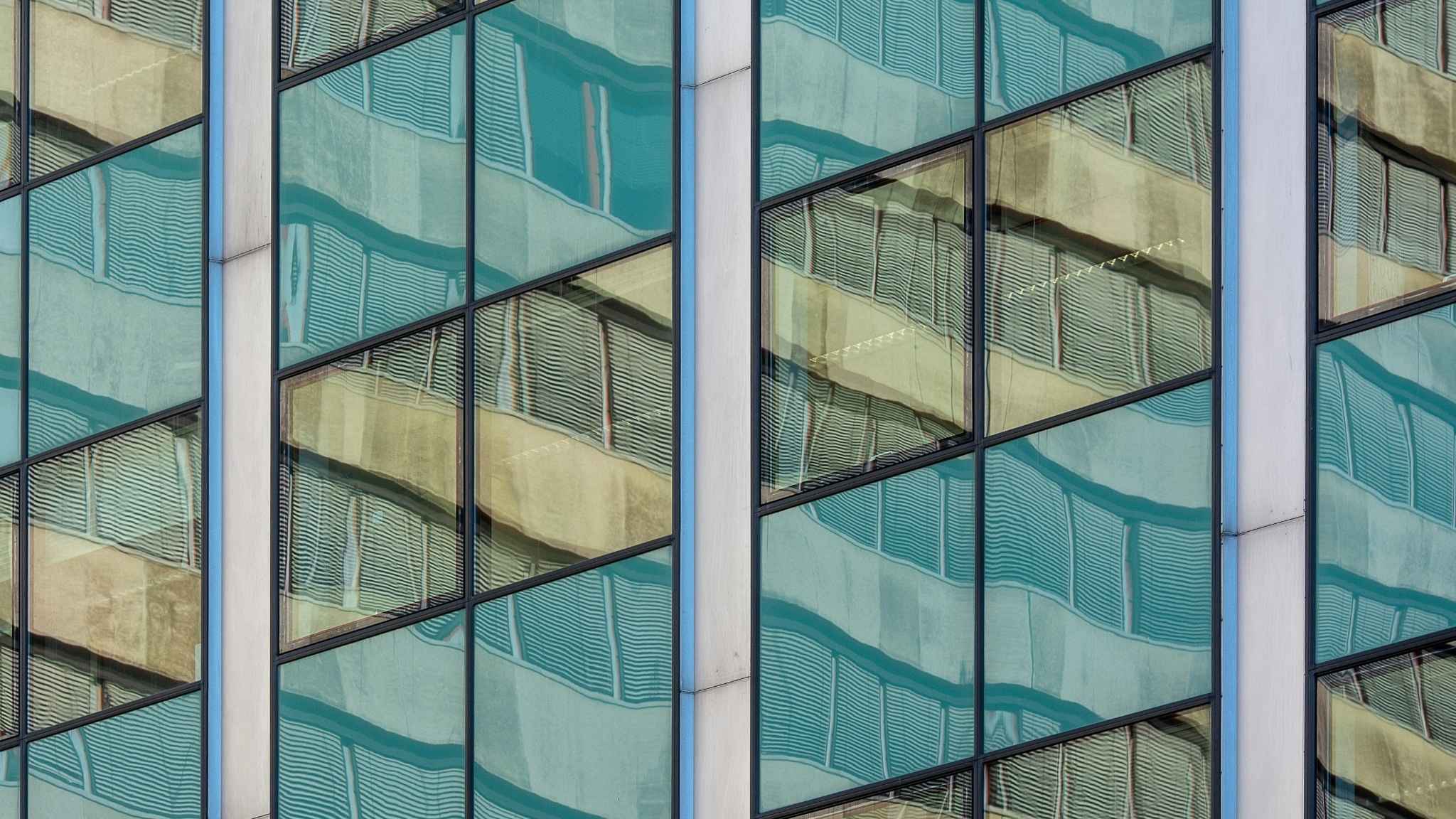Reflective glass on a skyscraper building.