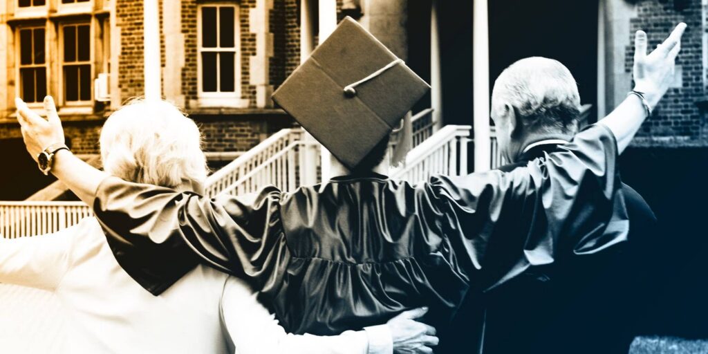 A graduation student stood in between a woman and a man.