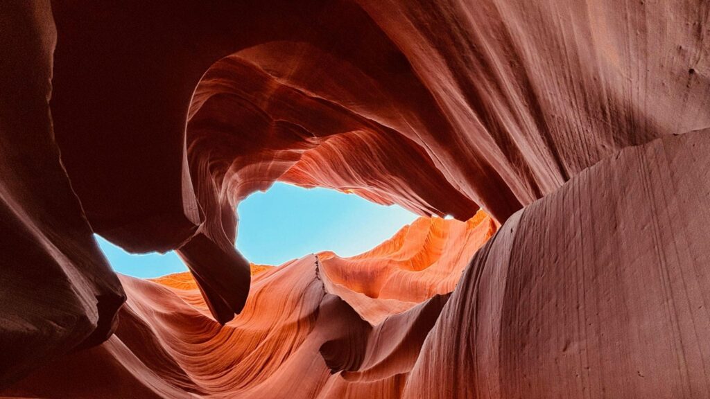 An orange canyon with blue sky.