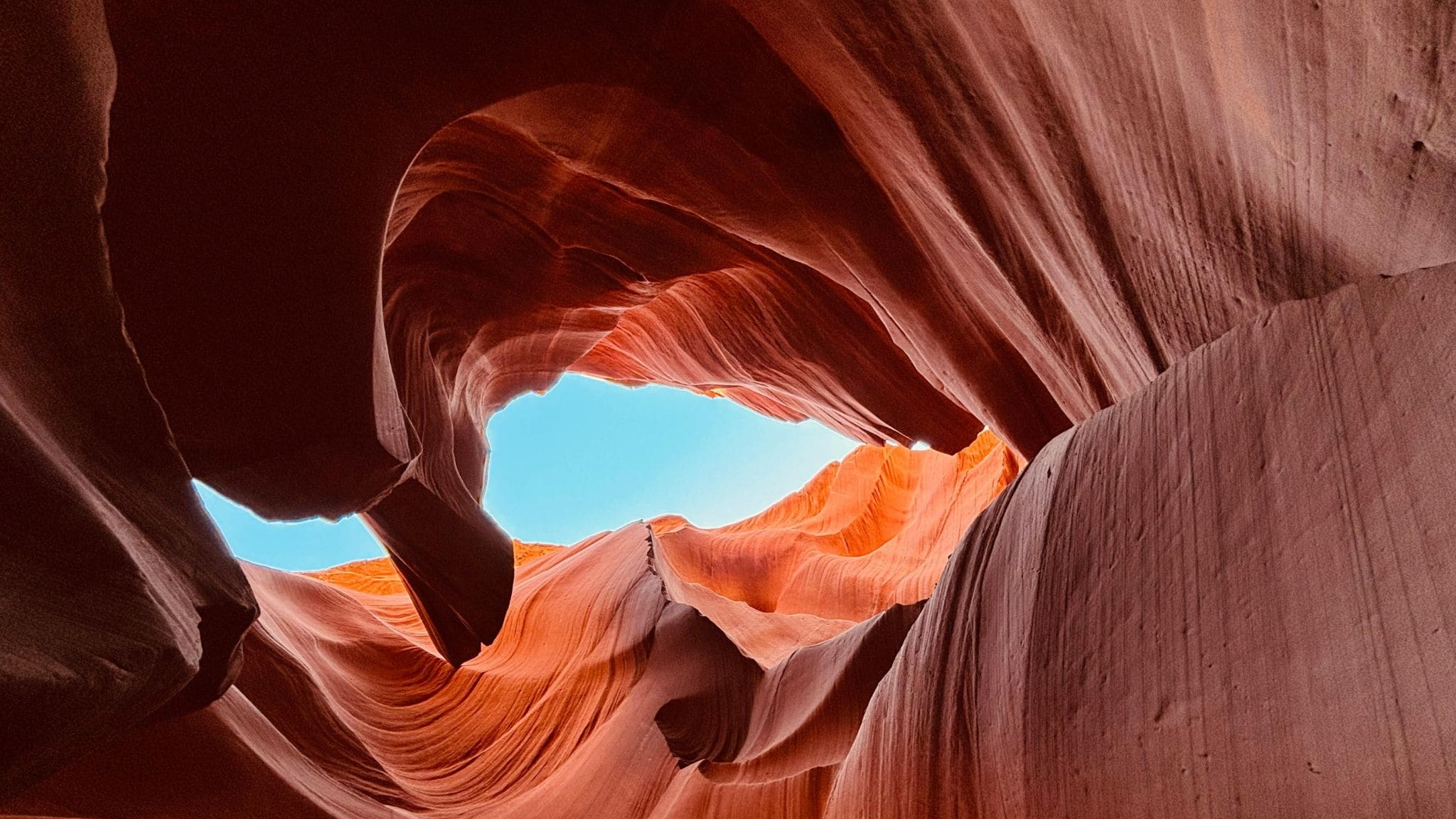 An orange canyon with blue sky.