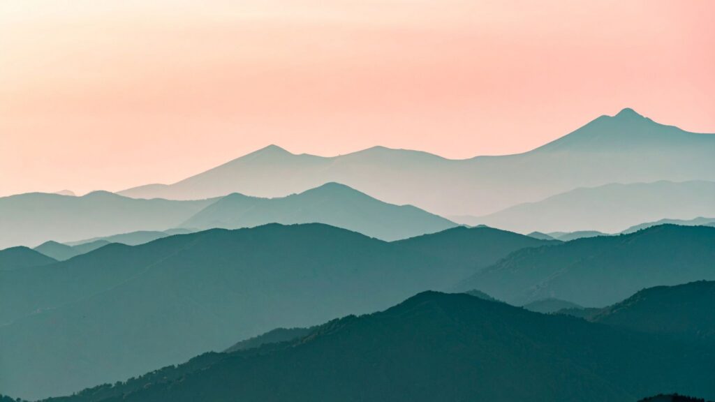 Mountain range with pink sky.